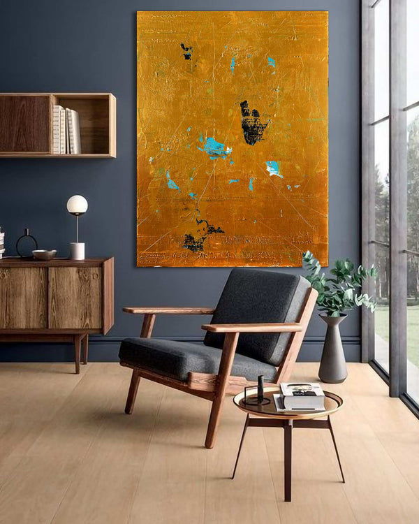 Ad Vitam, gold original abstract painting shown in a styled living room, by Nemanja Nikolic