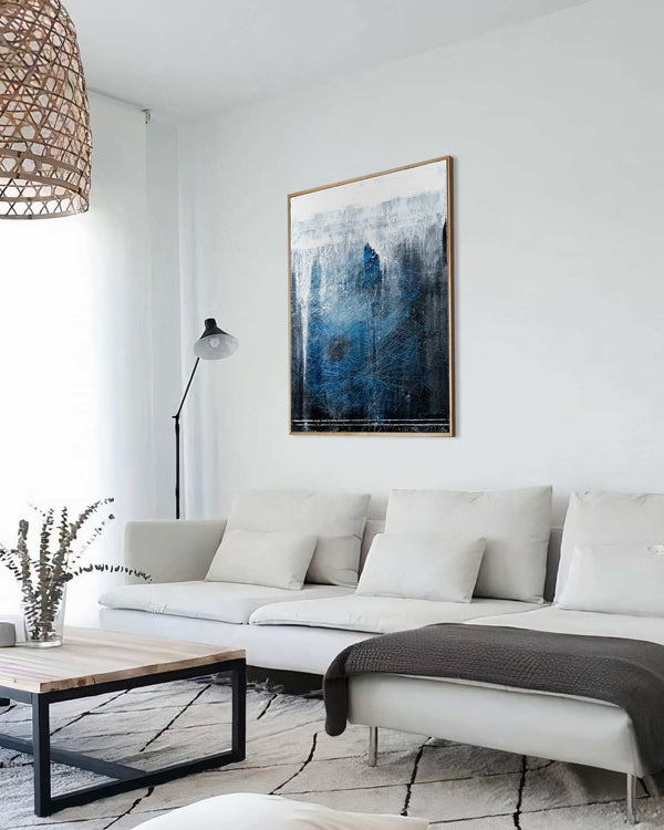 Beginning of the End, blue original abstract painting shown in a styled living room, by Nemanja Nikolic