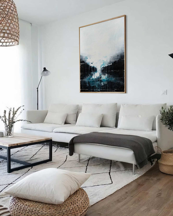 Between the Shadows, white original abstract painting shown in a styled living room, by Nemanja Nikolic