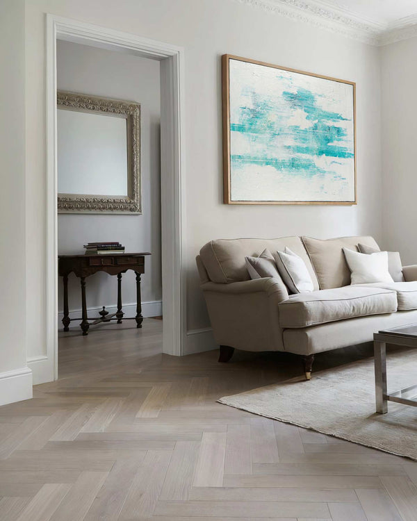 Frost, white original abstract painting shown in a styled living room, by Nemanja Nikolic